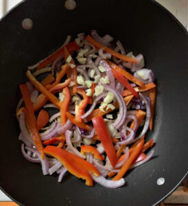 Frying pan with onions and peppers